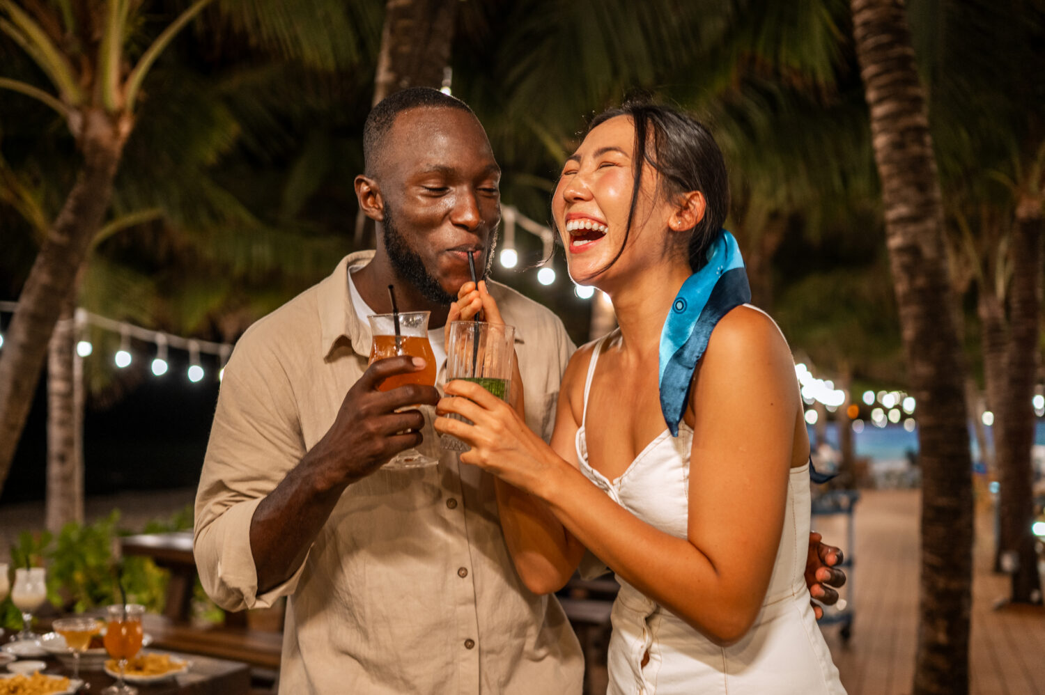 Couple Enjoys Tropical Cocktails